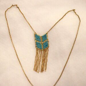 32" gold chain necklace with blue beaded pendant with 2" chain tassels at end